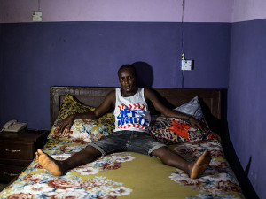 NIGERIA. Lagos. November 23, 2018. Adeshina, 25, student, in a relationship.
For Adeshina the first time was a mistake. He was 18 years old and a girl approached him flirting, then when it was too late she asked for money and he had to pay 1,500 NGN. Since then he’s been paying for girls once a week except when he’s had a girlfriend. He thinks men go with prostitutes because it’s easier for them, and even if they’re married, sex with their wives can be difficult and complicated.
Images for use only in connection with direct publicity for the group exhibition “Close Enough: New Perspectives from 12 Women Photographers of Magnum” presented at Hangar, Brussels, Belgium, from 7 September to 16 December 2023. These images are for one time non-exclusive use only and must not be electronically stored in any media asset retrieval database
•         Up to 3 Magnum images can be used without licence fees for online or inside print use only. Please contact Magnum to use on any front covers.
•         Images must be credited and captioned as outlined by Magnum Photos
•         Images must not be reproduced online at more than 1000 pixels without permission from Magnum Photos
•         Images must not be overlaid with text, cropped or altered in any way without permission from Magnum Photos